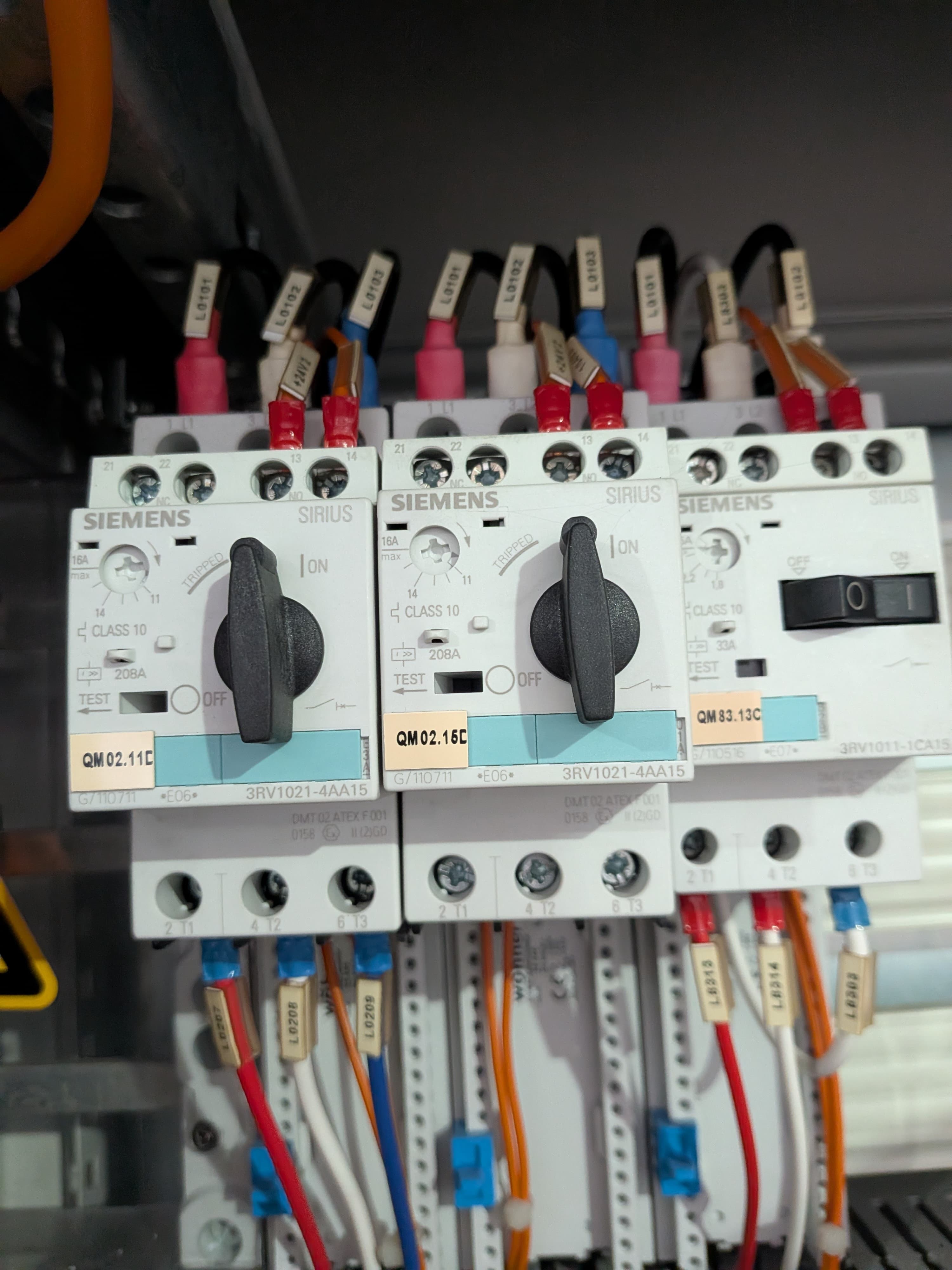 A thermal overload relay fitted below a contactor